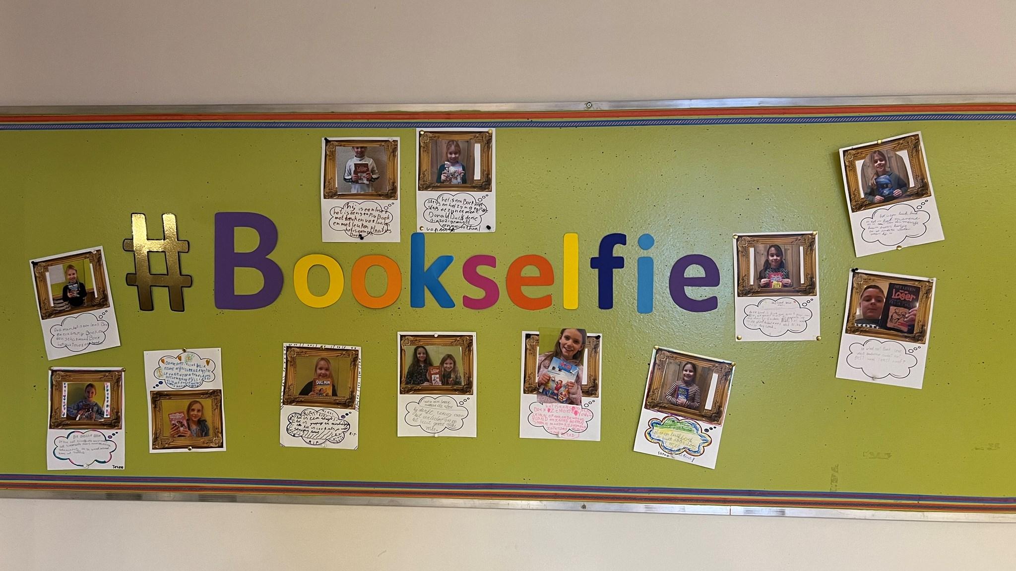 #Bookselfie wand van Basisschool De Tweestroom in Altforst met foto's van leerlingen die hun favoriete boeken presenteren. #Bookselfie wand van Basisschool De Tweestroom in Altforst met foto's van leerlingen die hun favoriete boeken presenteren.