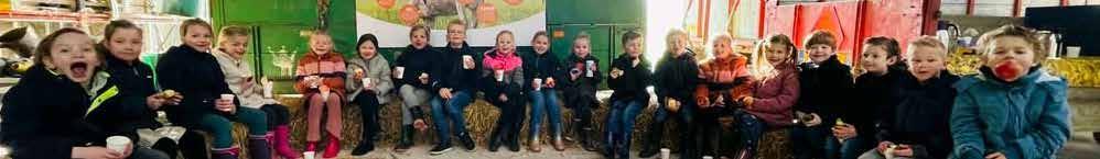 Groep kinderen van De Meander in Nieuwegein geniet van een activiteit met snacks en drinken.
