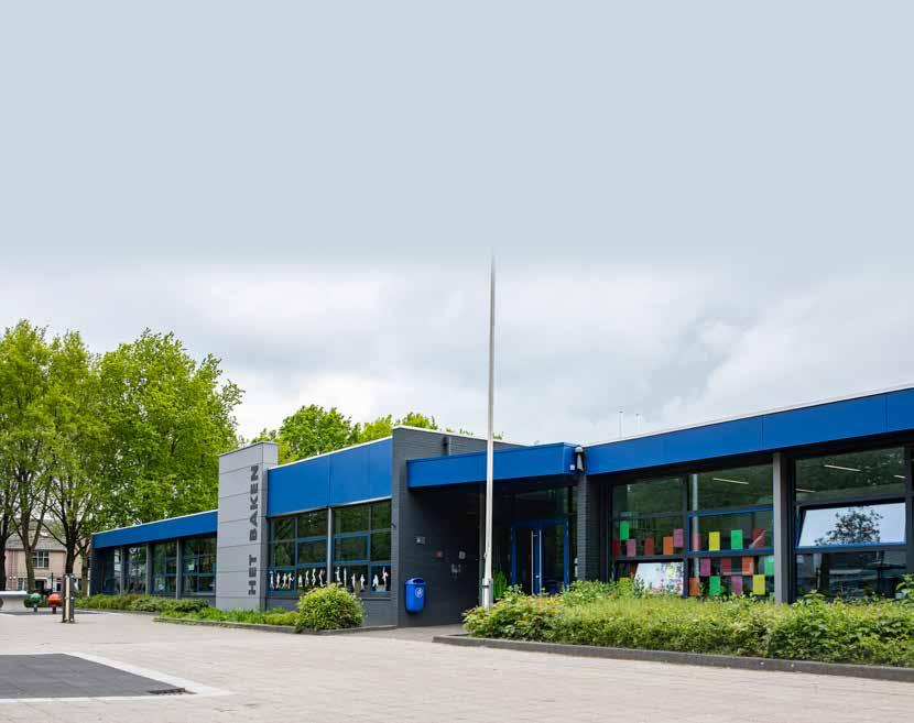 Het Baken I in Veenendaal met een modern schoolgebouw en groene omgeving. Het Baken I in Veenendaal met een modern schoolgebouw en groene omgeving.