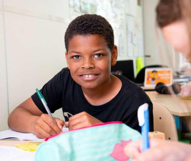 Kindcentrum De Spreng in Barneveld: een blije leerling die aan zijn schoolwerk zit. Kindcentrum De Spreng in Barneveld: een blije leerling die aan zijn schoolwerk zit.