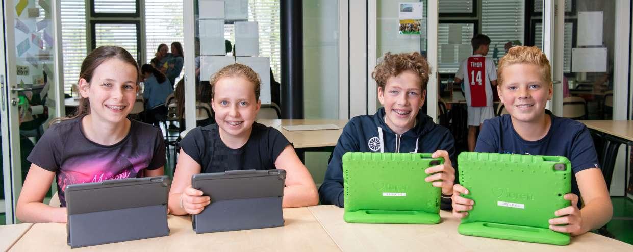 Kindcentrum De Spreng in Barneveld, waar leerlingen met tablets werken en leren. Kindcentrum De Spreng in Barneveld, waar leerlingen met tablets werken en leren.